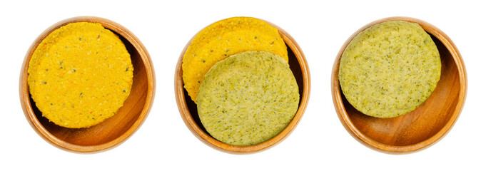 Vegetable patties in wooden bowls. Ready to fry vegan patties, made of butternut pumpkin or broccoli, on a soy and wheat protein base. Convenience food. Close-up isolated over white, macro food photo.