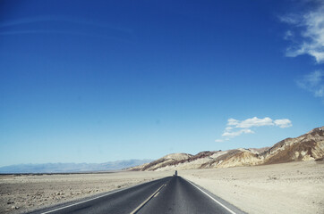 USA, DEATH VALLEY: Scenic landscape view of the desert mountains with the road