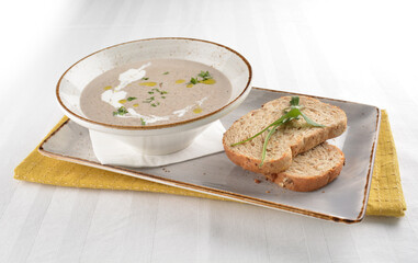 home made hot mushroom thick soup with French toast bread in white background western appetiser halal menu