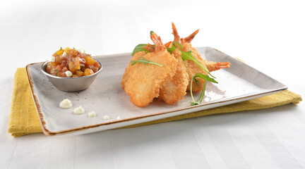 deep fried golden crispy big prawn tempura with small sour salad bowl in white background asian halal snack menu