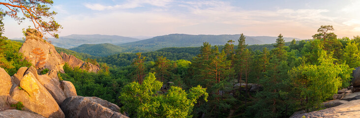 Carpathian mountains landscape at sunset, huge stone rocks of Dovbush, panoramic view