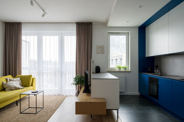 Open concept studio apartment with modern colors