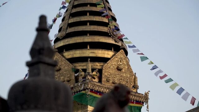 Macaque Monkey At Swayambhunath Stupa (Monkey Temple) In Kathmandu, Nepal. - Tilt-Up Shot