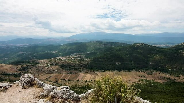 View from Rocca Calascio Castle, a medieval village located in the Gran Sasso National Park and the Laga mounts, Abruzzo. Located between the Navelli valley and the Tirino valley on a windy summer day