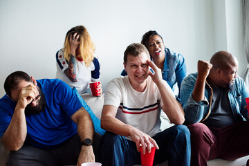 Friends cheering world cup with painted flag