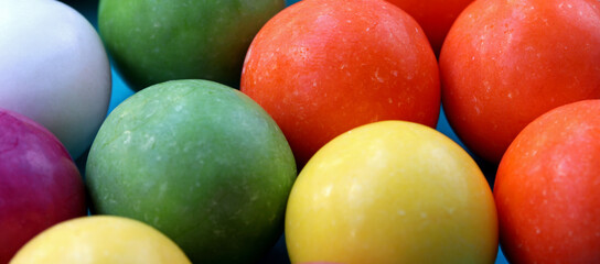 close-up colorful gum balls in the background