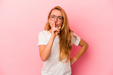Caucasian blonde woman isolated on pink background keeping a secret or asking for silence.