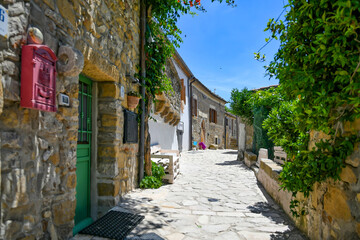A narrow street between the old houses of Rocchetta Sant'Antonio, a medieval village in Puglia region, Italy.