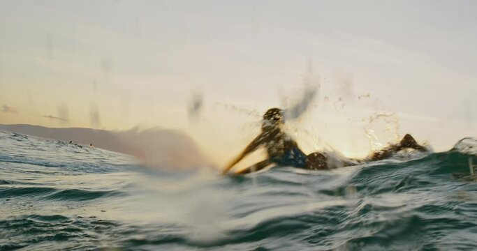 Hawaiian surfer girl paddling out on surfboard at sunset, epic lifestyle adventure, slow motion