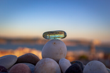 Stacking stones, summer vibes, blur background landscape Lisbon Portugal
