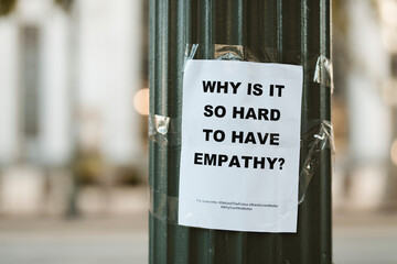 Why is it so hard to have empathy, flyer on a pole in downtown Los Angeles - obrazy, fototapety, plakaty