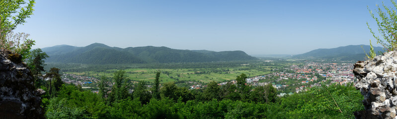 Fototapeta na wymiar Panoramic view of Kust city from Khust castle in Khust, Ukraine on June 24, 2021.