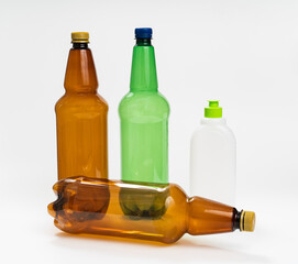 multicolored plastic bottles on white background. concept of recycling plastic