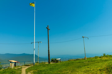 Fototapeta na wymiar Ukrainian flag on Ruins of Khust castle in Khust, Ukraine on June 24, 2021.