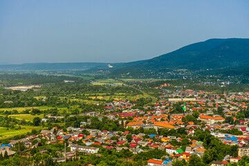 Obraz premium Panoramic view of Kust city from Khust castle in Khust, Ukraine on June 24, 2021.