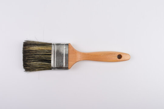 Clean new paint brush isolated on white background.