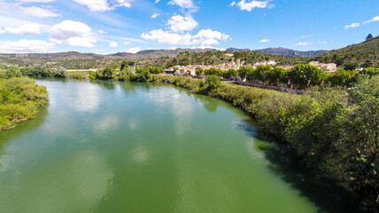 Fototapeta na wymiar aerial views of the ebro river with boats and villages