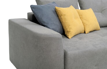 Fragment of a gray sofa with pillows, close-up, on a white background in isolation