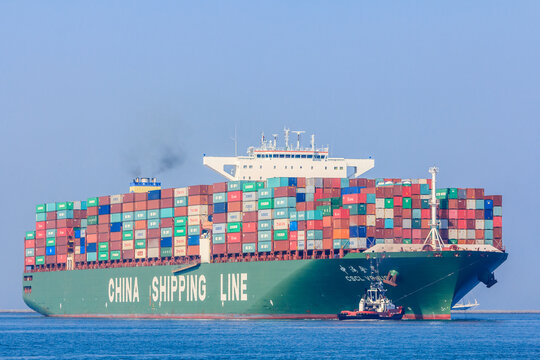 Rotterdam, the Netherlands - April 9, 2017: CSCL Venus container ship with tug boats in Rotterdam harbor
