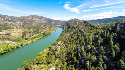 Fototapeta na wymiar aerial views of the ebro river with boats and villages