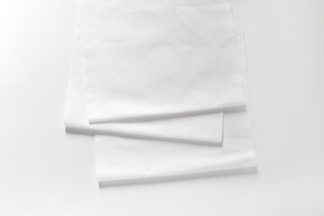 Obraz premium White cotton fabrics swatches on light background. Textile Mockup