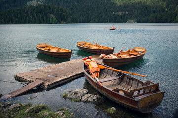 Group of wooden boats on Black lake in Montenegro