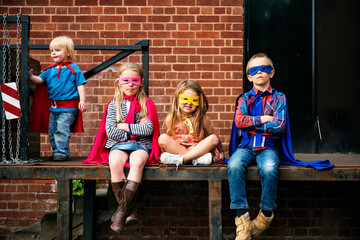 Kids in superhero costumes