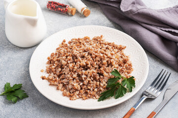 Boiled buckwheat on a plate. Healthy porridge enriched with vitamins. copy space,