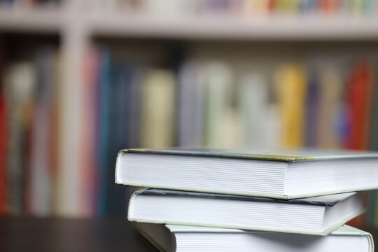 books on blurred bookshelf background, reading and learning