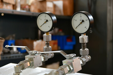 High pressure gauges on the hydraulic oil pump control unit for the hydraulic system.