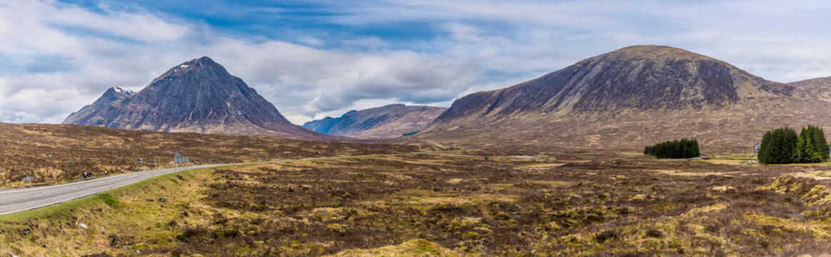 A panorama view of munros on the approach to Glencoe, Scotland on a summers day