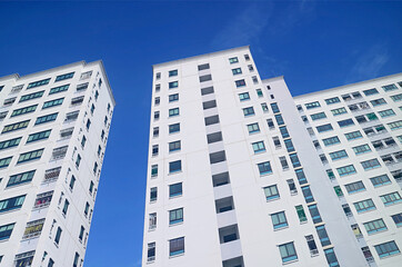 Fototapeta na wymiar Low Angle View of Modern Buildings against Vivid Blue Sunny Sky