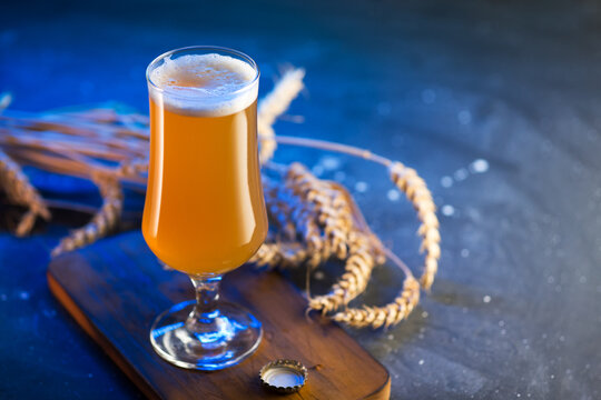 Craft beer, new england ipa in a glass, blue backlight