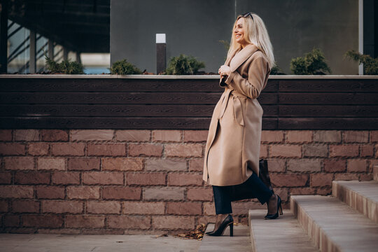 Elderly Business Woman Walking The Stairs