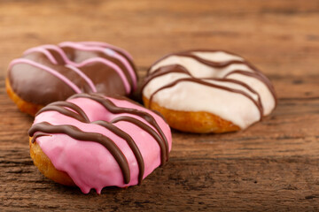 Delicious assorted colorful donuts on the table.