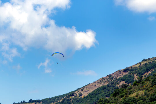 Paragliding in Ucmakdere Tekirdag Turkey . People jumping with colorful paraglider