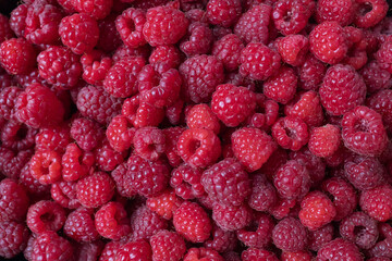 Fresh mouth-watering raspberries. Raspberry background