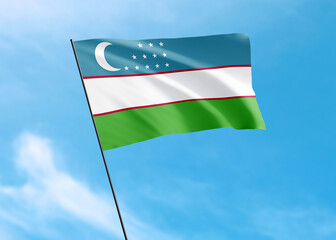 Uzbekistan flag flying high in the sky Uzbekistan independence day. World national flag collection
