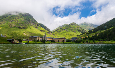 Fototapeta premium Panoramic view of the Nuria Valley with lake in the Catalan Pyrenees, Spain, Europe