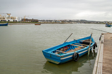 Fototapeta na wymiar blue raft moored at the mouth of the river bou rergreg