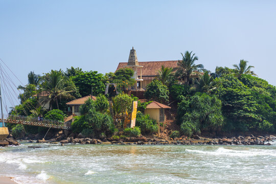 A small island near the beach by the ocean