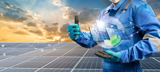 Technician holding Solar cell and eco icon over solar cell system, Solar cell energy, Care of the...