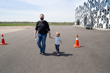 Family father and child on the airport background