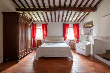 Interior of a double bedroom. Spartan ambiance and nothing luxurious.