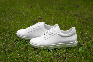 White sneakers on the grass