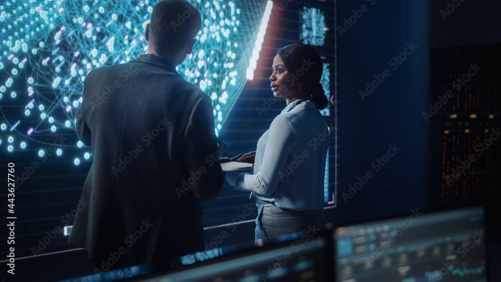 Poster Project Manager and Computer Science Engineer Talking while Using Big Screen Display Showing Neural Connections and Data. Telecommunications Company System Control and Monitoring Room.