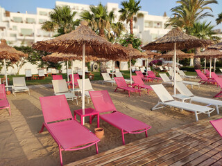 Lounge chairs in hotel garden