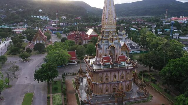 colorful cloud above pagoda of Chalong pagoda in twilight..beautiful architecture pagoda of Chalong temple in the night..4k colorful cloud scape sky sunset..
