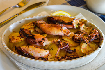 Roasted calamari with potatoes and lemon