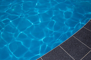 Obraz premium Blue ripped water in swimming pool. water surface background. summer background